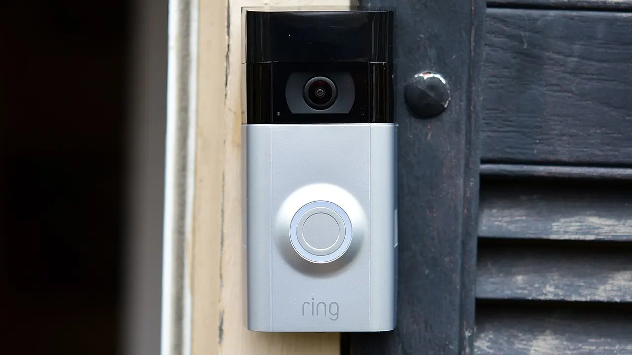 Video doorbell mounted on a front door frame